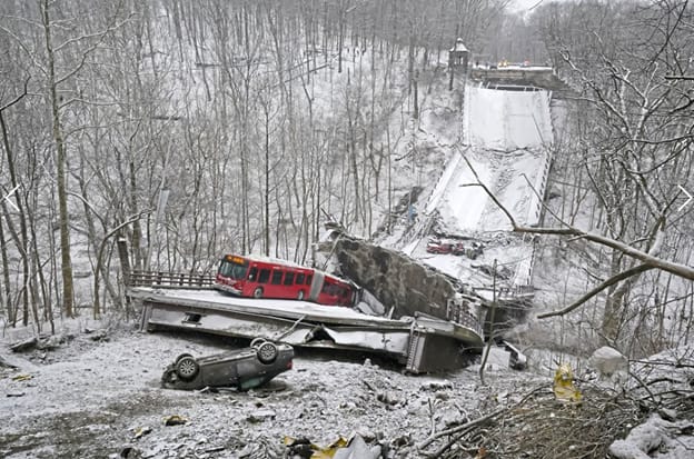 A Pittsburgh Port Authority bus and several vehicles lie in the collapsed structure. (Credit: Gene J. Puskar / AP Photo)