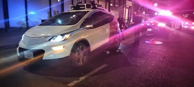 A Chevy Bolt operated by Cruise LLC, driving autonomously, appears to be on top of victim’s leg in photo taken by bicycle delivery person at the scene the night of October 2, 2023 and was published in the SF Chronicle. The crash occurred on Fifth Street between Market and Mission streets by the Westfield mall. Photo: Austin Tutone, SF Chronicle