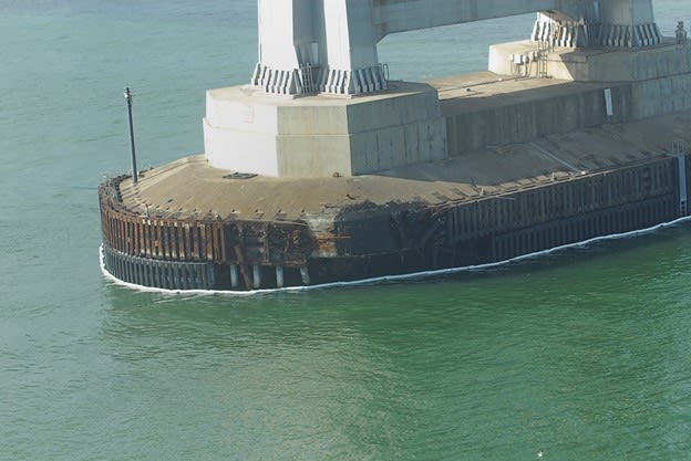 A footing of the Bay Bridge between San Francisco and Oakland shows damage after it was struck by Cosco Busan. Image: CWO Scott Epperson, U.S. Coast Guard.