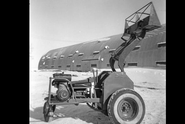 The first version of the Keller Loader was invented to meet the needs of a local turkey farmer. (Image Source: Bobcat Co.) 