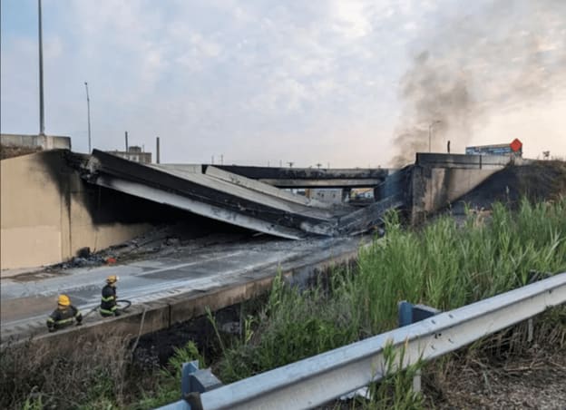 Firefighters put out the fire that collapsed the Cottman Avenue overpass on I-95 in Northeast Philadelphia.