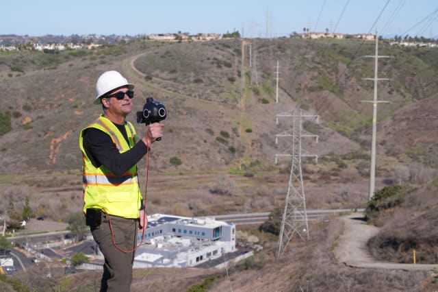 Looq AI’s technology includes the “Q”—a handheld or vehicle-mounted, multi-camera unit with integrated survey-grade GPS and an AI processor. The mobile system allows the seamless capture of field data for facilities such as electric transmission lines. Image courtesy of Looq AI.