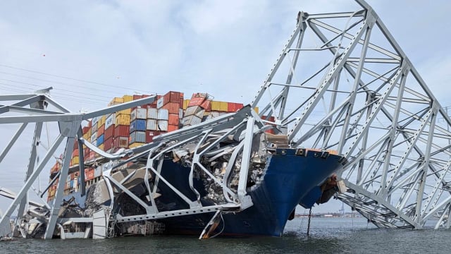 Cargo ship Dali is pinned down by sections of the Francis Scott Key Bridge after colliding with a bridge tower. Image: U.S. Army Corp of Engineers.