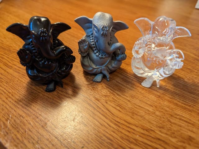 [Three different material and process productions of the Hindu god Ganesha, including metal 3D printed in the middle, from India-based Objectify // Image Source: Author]