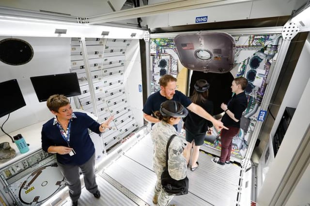 Shelley Peterson (left) shows off Lockheed Martin's use of AR. (Image courtesy of Lockheed Martin.)