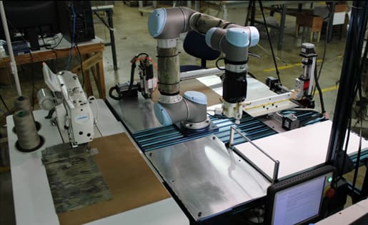 Traditional sewing machines were controlled via Robot Operating System (ROS) to achieve synchronized operation with the robot. (Image: ARM Institute)