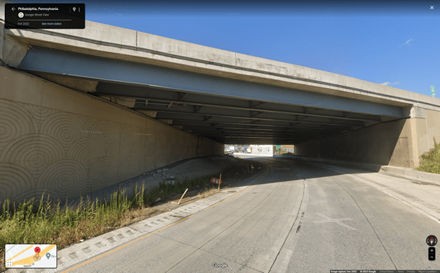 If there was fuel truck taking the exit for Cottman Avenue from I-95, this is what they would have seen as the headed under the overpass. Note the curve in the road and exposed steel beams overhead -- common in overpass design.